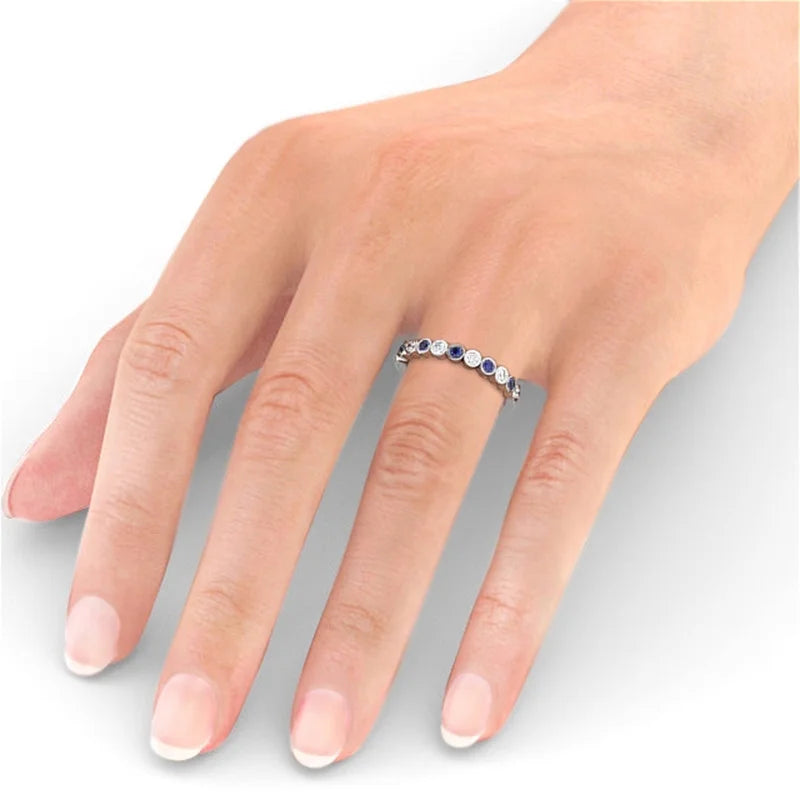 14K White Gold Eternity Band with Round Cut Diamond and Blue Sapphire Q19994
